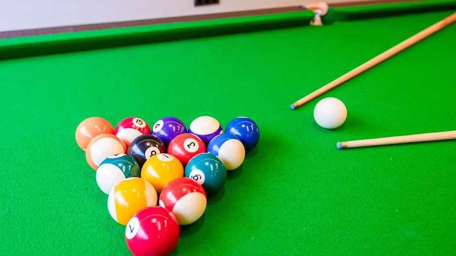 Indoor gaming area at DLS Divine River Resort and Spa featuring pool table 
